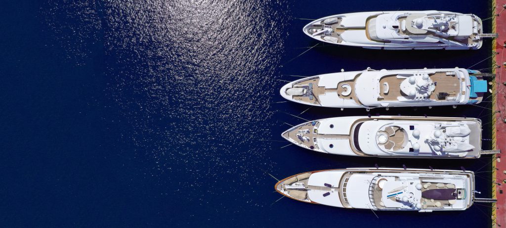 image of yachts lined up in a marine