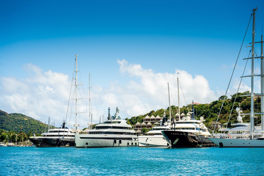 Image of yachts in harbour with blue sky