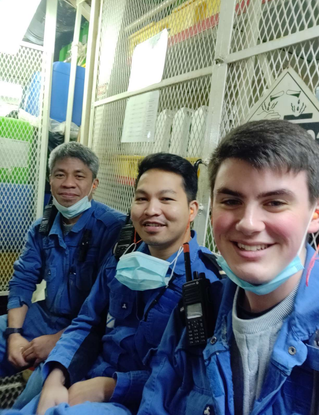 Tom Bishop smiling in a selfie with two Filipino crew mates | National Careers Week